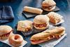 Greggs vegan products including a ring doughnut, sausage roll and festive bake