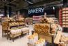 A freshly stocked M&S bakery with pretzels, sourdough rolls, and more
