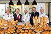 Clan d'Oeil - Le Duff Group founder and CEO Louis Le Duff (second left) and Bridor CEO Philippe Morin (second right) stand with chefs