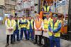 Carlisle MP John Stevenson (centre in orange vest) stands with Pladis employees during the opening of its new warehouse.  2100x1400