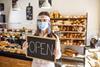 Woman working in bakery with mask on