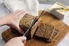 Rye bread being sliced