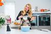 Alana Spencer, founder of Ridiculously Rich By Alana, making a cake