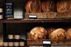 White and wholemeal sourdough loaves by Stir Bakery displayed on shelves   2100x1400