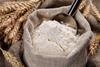 White flour in bag with wheat