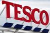 Tesco suffers record loss