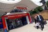 Tesco reports large fall in profits