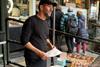 Bread Ahead - Founder Matthew Jones at the streetside doughnut kiosk of his flagship store at Borough Market