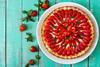 Strawberry tart on a mint green background