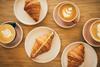 Birds eye view of coffee and croissants