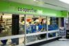 Co-op boss takes pay cut as profits dip