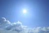 Sun high in a blue sky