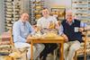 Barnaby Aldrick – Luke’s Bakery owner Luke Jenneson sits between Pipers Crisps co-founders James Sweeting (left) and Alex Albone - 2100x1400