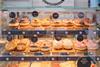 Doughnuts on display at a Warrens Bakery shop 2100x1400
