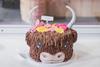 A cake decorated to look like a Highland Cow