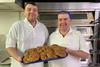 Hame Bakery owner Patrick Jackson (right) and his son, also a baker called Patrick, hold a tray of their new healthier butteries  - Food Standards Scotland