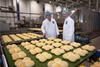 Mandy Jones - Jones Village Bakery head of operations Andy Beckett left and CEO Simon Thorpe at the new roll line in the main Wrexham site