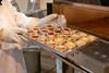 Interfood Technology - Baker uses a tray supplied by Creeds Direct