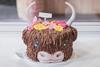 A cake decorated to look like a Highland Cow