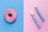 A doughnut and weight-loss jabs on pink and blue background