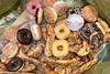 Doughnuts and pastries in a bin