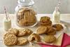 Lots of lovely cracked cookies with two mini bottles of milk
