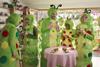 People dressed as caterpillars having a tea party