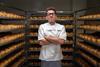 A room full of sourdough loaves with Jason Geary in baker's whites in the middle