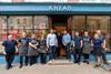 Knead Bakery - Co-founders John Hawes and Kris Biggs (centre in shirts) join staff members outside the new Oxford bakery shop - 2100x1400