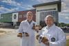Jones Village Bakery managing director Robin Jones (left) and his brother, projects director Christien Jones, stand outside the 'super bakery' site in Wrexham
