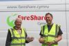 Steve Barkley (left) and Dennis Foley from FareShare display bakery items redistributed by the charity.  2100x1400