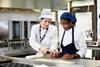 A trainee and an instructor in a bakery lesson at Moulton College 2100x1400