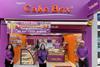 Cake Box CEO Sukh Chamdal with franchisee Sharon Rupra opening its 150th store