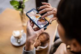 Woman taking photo of baked goods