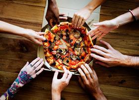Image-4-–-People-sharing-a-hot-pizza