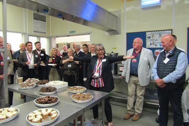 Oswin Project founder Fiona Sample (centre) celebrates opening the bakery