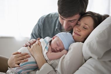 Getty Images - Jose Luis Pelaez Inc -181215741 couple holding newborn baby