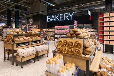 A freshly stocked M&S bakery with pretzels, sourdough rolls, and more