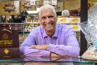 Cake Box - CEO Sukh Chamdal stands behind the counter of an Ambala Foods shop - 1586x1800