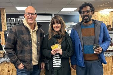 Romesh Ranganathan (right) stands with Coughlans Bakery MD Sean Coughlan and raffle prize winner Kerrie at the Maidenbower shop in Crawley  - Coughlans Bakery  2100x1400