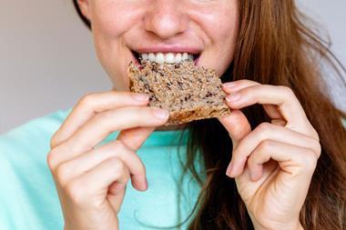 Person-Eating-Wholemeal-Bread-With-Seeds-01 RS 2