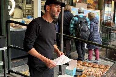 Bread Ahead - Founder Matthew Jones at the streetside doughnut kiosk of his flagship store at Borough Market