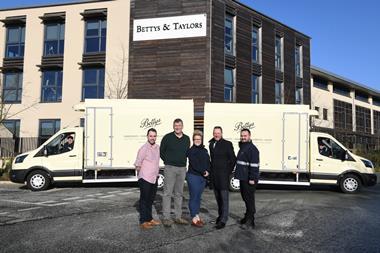 Bettys product director Paul Farr (front, second right) stands with colleagues, ProGreen head Michelle Miles (front, centre) and Prohire CEO Pat Skelly (front, second right) in front of the new electric vans. 2100x1400