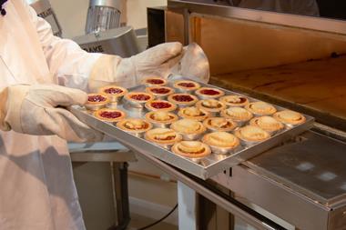 Interfood Technology - Baker uses a tray supplied by Creeds Direct