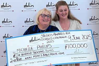Michelle and daughter Ashley collecting the cheque