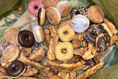 Doughnuts and pastries in a bin