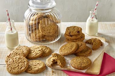 Lots of lovely cracked cookies with two mini bottles of milk