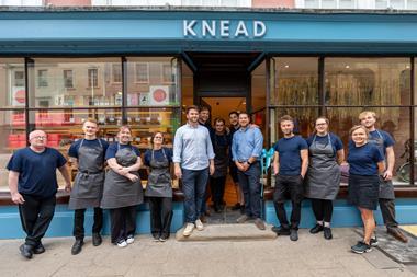 Knead Bakery - Co-founders John Hawes and Kris Biggs (centre in shirts) join staff members outside the new Oxford bakery shop - 2100x1400