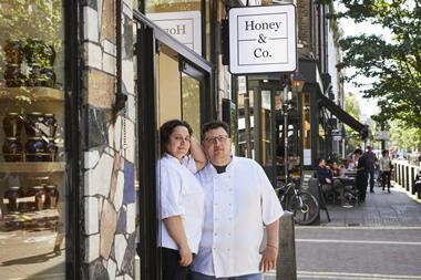 Honey & Co. co-founders Sarit Packer and Itamar Srulovich stand outside their Lamb's Conduit Street restaurant. 2100x1800