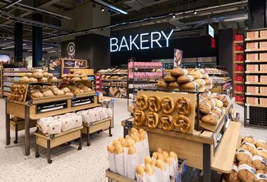 A freshly stocked M&S bakery with pretzels, sourdough rolls, and more